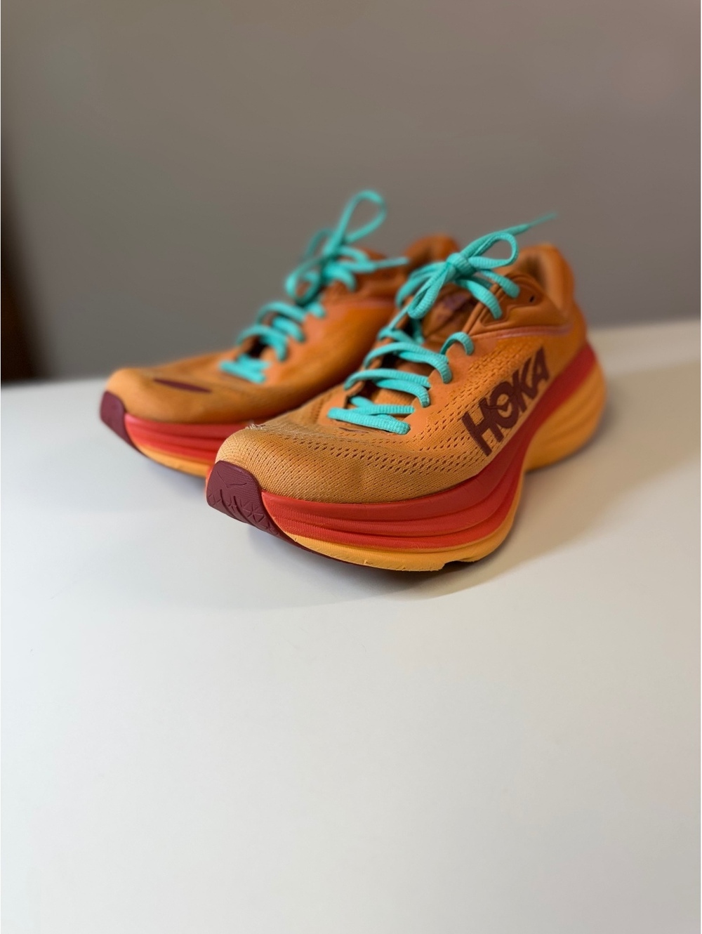 Hoka Running Shoes Bondi 8 Orange with Turquoise Laces